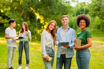 College Social Life. Diverse Multicultural Students Posing Outdoors During Break In Study