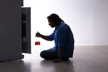 Young man suffering from alcoholism