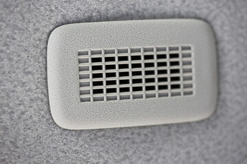 Microphone grill in vehicle ceiling