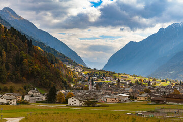 Beautiful panorama view of Poschiavo town in valley with Swiss Alps in background, in autumn with...