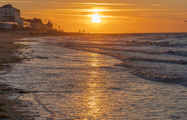 Naklejka premium Langrune Sur Mer, France - 08 03 2020: Panoramic view of the sea from the beach at sunset