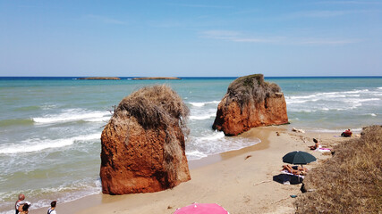 Rocks in the sea in the beach in the Torre Guaceto state nature reserve, Brindisi, Puglia, Italy