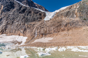 Angel Glacier hangs over a cliff below Mount Edith Cavell in Jasper National Park Canada