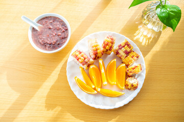 Chinese nutritious breakfast with red bean porridge and corn