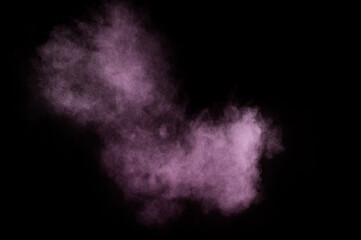Purple powder explosion on black background. Colored powder cloud. Colorful dust explode. Paint Holi..