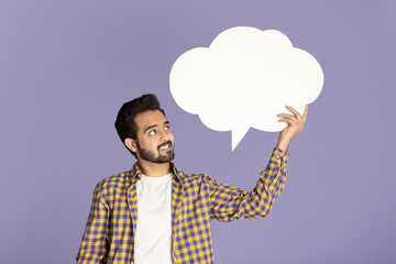 Handsome Indian man holding speech bubble with empty space for your design on lilac background