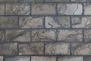 A floor of old, dirty  and weathered Industrial tiles as found in a factory. Background image.