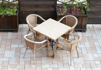 Terrace with empty tables and chairs
