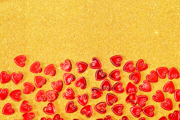 Red glass hearts on a yellow gold background