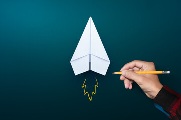 Startup concept, White paper plane and businessman hand drawn launching plane