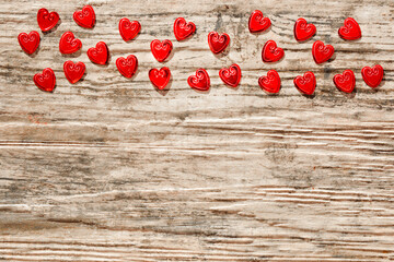 Red hearts on a brown background