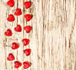 Red hearts on a brown background