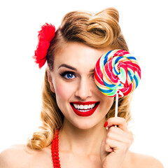 Half face portrait of excited woman with lollipop covering one eye. Pin up girl with happy smile. Retro style image. Isolated over white background. Square composition. Ophthalmology concept.