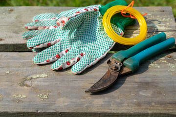 garden tool. Gloves and scissors on a wooden table