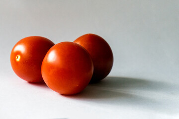 red tomatoes on a grey background