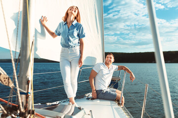 Couple Having Fun On Luxury Yacht Enjoying Boat Tour Outdoors