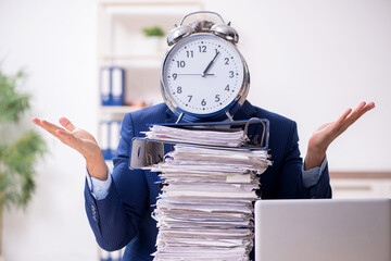 Young male employee unhappy with excessive work