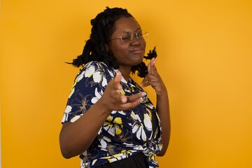 Hey you, bang. Joyful and charismatic good-looking emotive African American woman with blond curly...