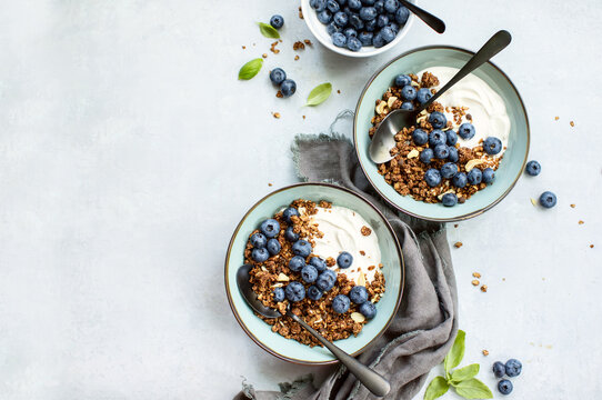 Granola and blueberry breakfast with plain yogurt, top down view