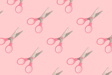 Scissors pattern on a pink pastel background. Monochrome composition.