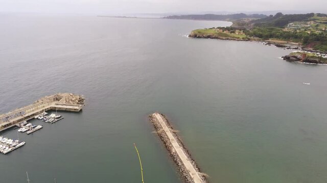 Harbour and landscape in coastal village. Candas,Asturias. Spain. Aerial Drone Footage