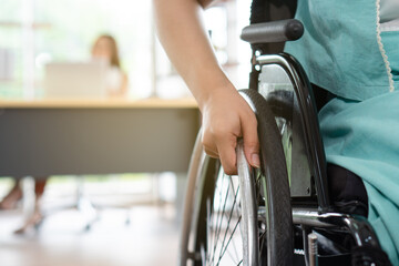 close up picture of young disabled woman sitting in the wheelchair. disability and handicapped...