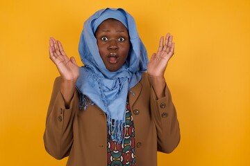 Surprise concept. Portrait of astonished beautiful girl looking surprised in full disbelief wide open mouth with hands near face with braided hair. Positive emotion facial expression body language.