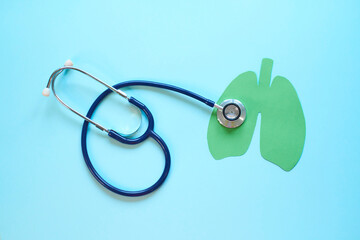 Lung health therapy medical concept . silhouette of the lungs and a stethoscope on a blue background. concept of respiratory disease, pneumonia, tuberculosis, bronchitis, asthma, lung abscess