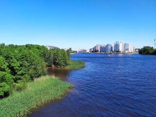 View of the river, silhouette of St. Petersburg city. Clear summer's day on the riverbank