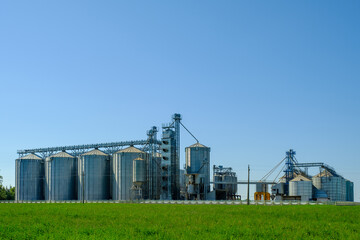 Agricultural factory with grain silos for storage and drying of grain crops. Agribusiness concept.