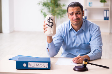 Young man in courthouse in divorcing concept
