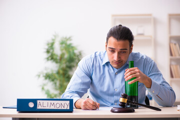 Young man in courthouse in divorcing concept