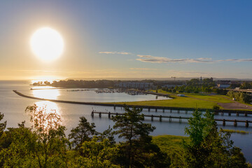 Landscape photograph of the inlet and piers of the city of Vänersborg, Sweden, taken at sunrise in an early morning.