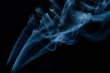 Fototapeta premium Bluish smoke on black background