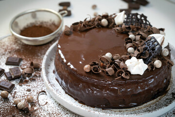 Chocolate cake with chocolate glaze and cream, 