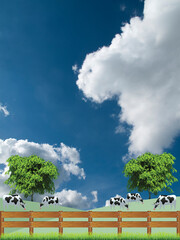 Picturesque rural scene with a herd of cows grazing in grass pasture field set against a blue cloudy sky