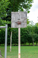 The old basketball hoop made of wood.