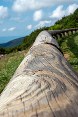 wooden fence along with the hill road	