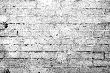 Texture of a brick wall with cracks and scratches which can be used as a background