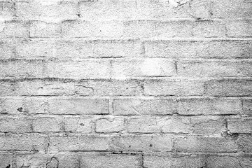 Texture of a brick wall with cracks and scratches which can be used as a background