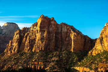 Mountain in the sunset light. Zion's cliff in evening colors.