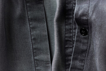 Close up of dark Men's shirt.	