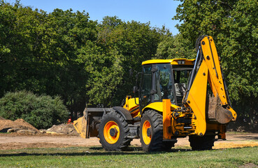 Construction machinery tractor with bucket and excavator