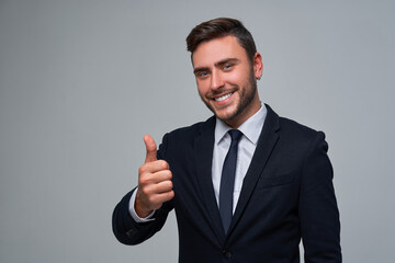 Close up portrait young man businessman. Caucasian guy business suit studio gray background.