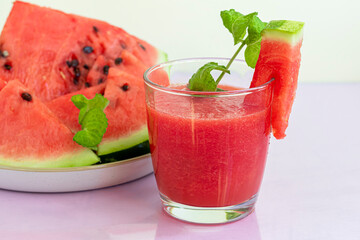Watermelon pulp smoothie. Delicious red sliced watermelon on a plate. Stock of fiber and fructose....