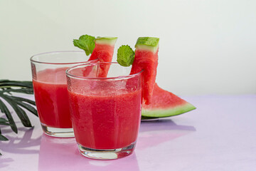 Watermelon pulp smoothie. Delicious red sliced watermelon on a plate. Stock of fiber and fructose....