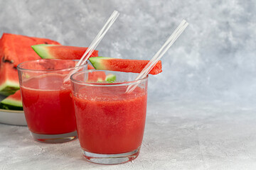 Watermelon pulp smoothie. Delicious red sliced watermelon on a plate. Stock of fiber and fructose. Summer food concept.