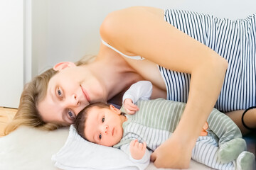 Fototapeta na wymiar Happy mother with newborn baby