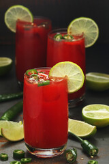 Jalapeno tomato margarita cocktail with lime	
