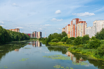 Fototapeta premium Russia, Moscow region, the city of Balashikha. View of the Pekhorka river on a summer sunny day.